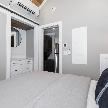 Interior view of the bedroom room of a luxurious Coldwater cabin at Ocoee River Mountain Cottages