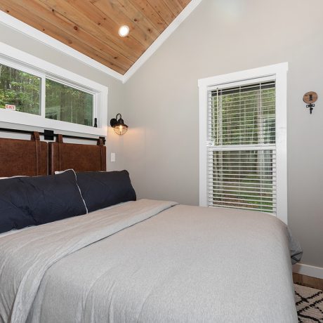 Interior view the of bedroom of luxurious Coldwater Cottage at Ocoee River Mountain Cottages