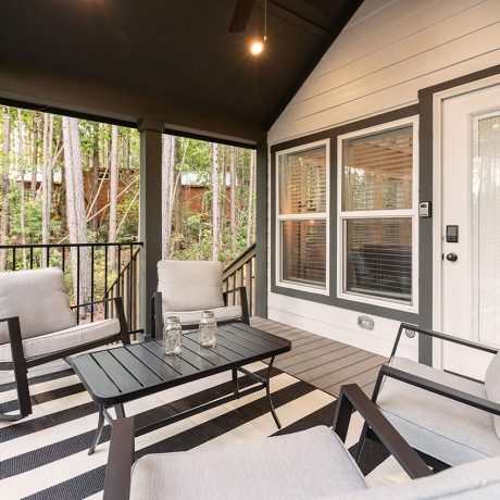 Exterior view of the porch of the luxurious Coldwater Cottage at Ocoee River Mountain Cottages