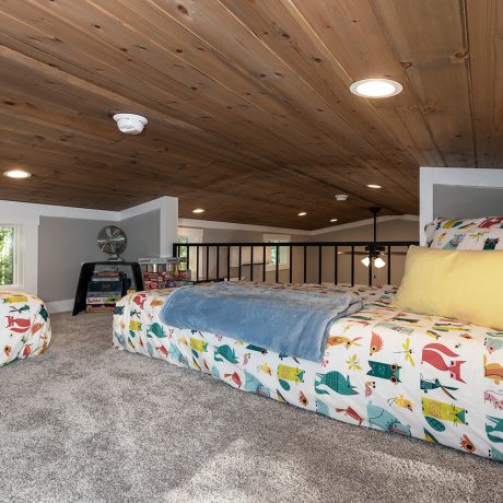 Interior view of the bedroom of luxurious Coldwater Cottage at Ocoee River Mountain Cottages