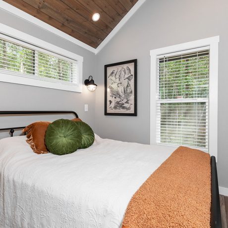 Interior view of the bedroom the of luxurious Swayback Cottage at Ocoee River Mountain