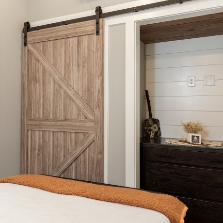 Interior view of the bedroom room of a luxurious Swayback cabin at Ocoee River Mountain Cottages