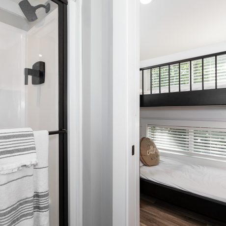 Interior view of the bedroom room of a luxurious Swayback cabin at Ocoee River Mountain Cottages