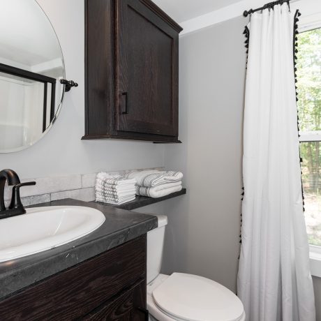 Interior view of the bathdroom room of a luxurious Swayback cabin at Ocoee River Mountain Cottages