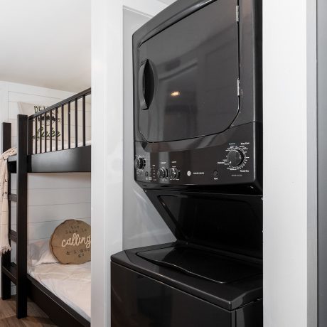 Interior view of the bedroom room of a luxurious Swayback cabin at Ocoee River Mountain Cottages