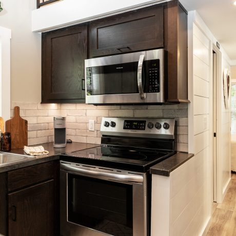 Interior view of the Kitchen room of a luxurious Swayback cabin at Ocoee River Mountain Cottages