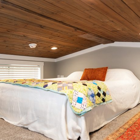 Interior view of the bedroom of luxurious Swayback Cottage at Ocoee River Mountain Cottages