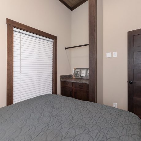 Interior view of the bedroom of a luxurious Cumberland cabin at Ocoee River Mountain Cottages