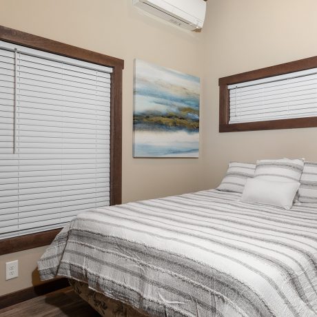 Interior view of the bedroom of a luxurious Cumberland cabin at Ocoee River Mountain Cottages