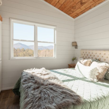 Interior view of bedroom of luxurious Cumberland Cottage at Ocoee River Mountain Cottages