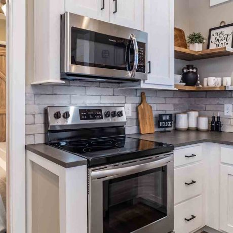 Interior view of the kitchen of a luxurious Cheaha cabin at Ocoee River Mountain Cottages