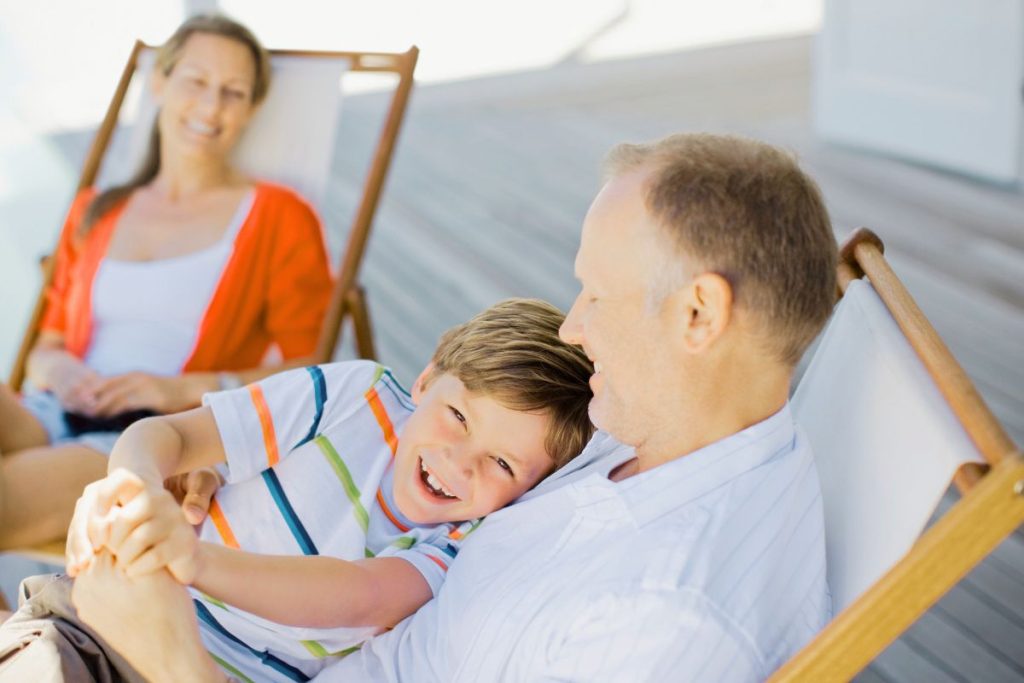 Family relaxing on a cottage deck in Copperhill TN